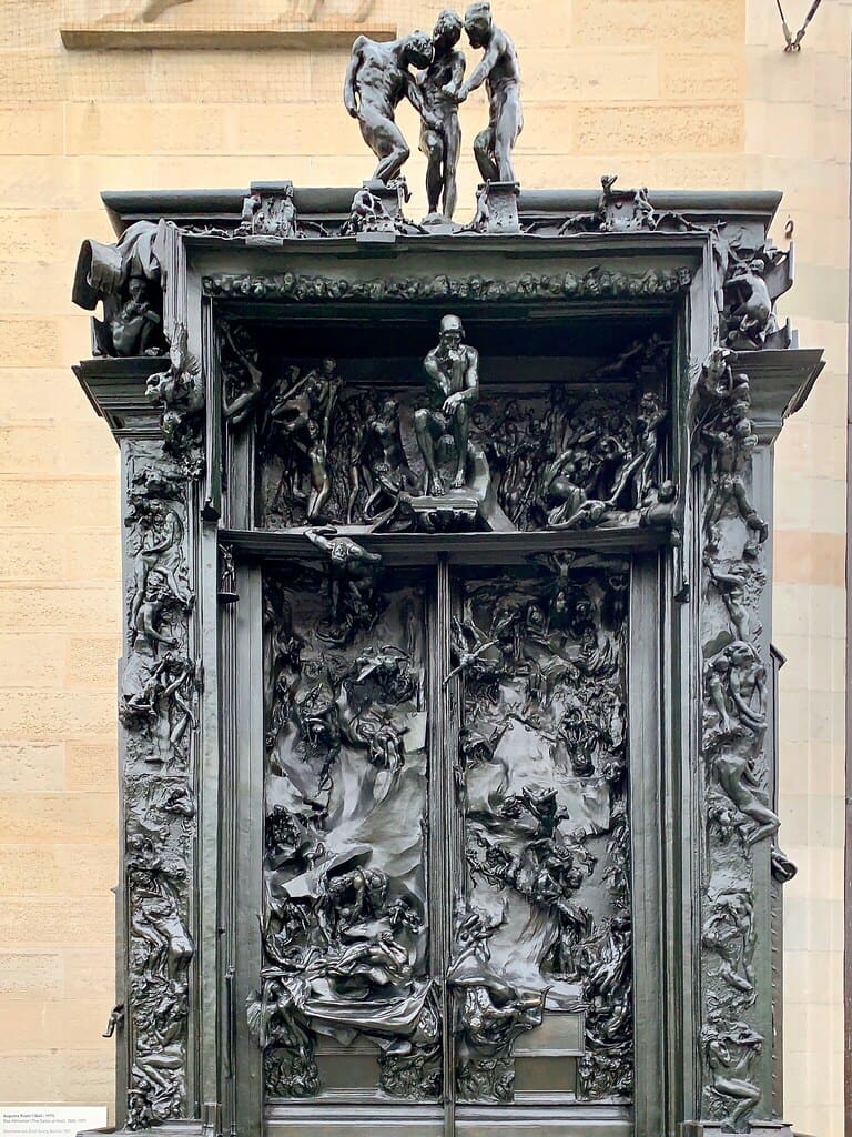 Auguste Rodin's Gates of Hell on the top of which is a miniature of the statue of doubt